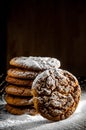 A stack of cookies dusted with icing sugar