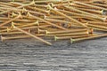 Stack of copper screws on wooden board Royalty Free Stock Photo