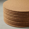 Stack of cork coasters, each with a rounded shape and uniform thickness, arranged Royalty Free Stock Photo