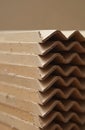 Stack of corrugated cardboard corner protectors. Brown paper material provides edge security for shipping, packaging. Eco Royalty Free Stock Photo