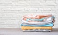 Stack of cotton colorful clothes empty space background. Royalty Free Stock Photo
