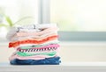 Stack of cotton colorful clothes,folded clothing on table empty space Royalty Free Stock Photo