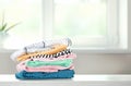 Stack of cotton colorful clothes,folded clothing on table empty space Royalty Free Stock Photo