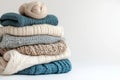 A stack of cozy knitted sweaters in soft, neutral hues, showcasing delicate textures and fine craftsmanship. The wool Royalty Free Stock Photo