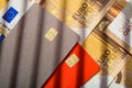 Stack credit cards, close up view with fifty Euro currency bills