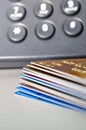 Stack of Credit cards and telephone in background Royalty Free Stock Photo