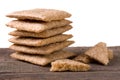 Stack of crisp bread on a wooden table isolated white background Royalty Free Stock Photo