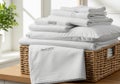 Stack of crisp white organic cotton linens, including pillowcases Royalty Free Stock Photo