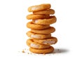 A stack of crispy onion rings piled vertically on a white surface. Royalty Free Stock Photo