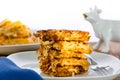 Stack of crispy waffle hash browns on a plate