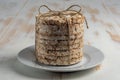 Stack of crunchy rice cakes on white wooden table. Food background Royalty Free Stock Photo