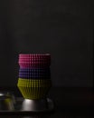 A stack of pink, purple and green cupcake liners Royalty Free Stock Photo