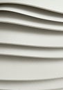 Stack of curved, overlapping sheets of white textured paper. The smooth, evenly space Royalty Free Stock Photo