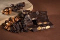 Stack of dark chocolate pieces with roasted almonds and raisins Royalty Free Stock Photo