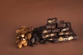 Stack of dark chocolate pieces with roasted almonds and raisins Royalty Free Stock Photo