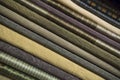 Stack of dark folded textile fabrics