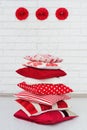 Stack of decorative red pillows