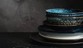 Stack of Deep Ceramic Bowls and Plates with Blue and Black Glaze pottery dishware Royalty Free Stock Photo