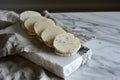 A stack of delicious cookies sitting on top of a table, ready to be indulged, Discs of Italian White Alba Truffle on a marble slab Royalty Free Stock Photo