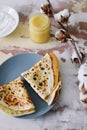 Stack of delicious homemade pancakes on plate with honey, sour cream and tea. Breakfast. Rustic style, close up top view. Flat lay Royalty Free Stock Photo