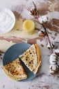 Stack of delicious homemade pancakes on plate with honey, sour cream and tea. Breakfast. Rustic style, close up top view. Flat lay Royalty Free Stock Photo