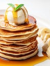 Delicious pancakes on plate with maple syrup and ice cream topping Royalty Free Stock Photo