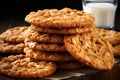 Stack of Delicious Oatmeal Cookies and a Glass of Milk on Rustic Wooden Table with Copy Space