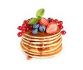 Stack of delicious pancakes with fresh berries and syrup on background Royalty Free Stock Photo