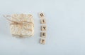 Stack of delicious puffed crispbread tied with rope and wooden letters
