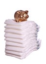 Stack of diaper with golden piggybank