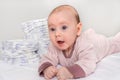 Stack of diapers or nappies with newborn baby
