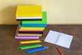 Stack of different books and colored pencils. Copy space Royalty Free Stock Photo