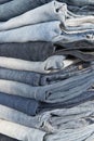 Stack of different old worn blue jeans Royalty Free Stock Photo