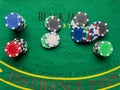 Stack of different poker chips on casino gaming table