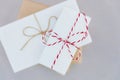 Stack of different sizes gift boxes wrapped in white and craft paper tied with twine ribbon. Christmas New Year presents shopping