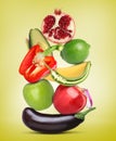 Stack of different vegetables and fruits on yellow background Royalty Free Stock Photo