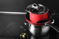 Stack of dirty kitchenware on cooktop in kitchen Royalty Free Stock Photo