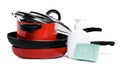 Stack of dirty kitchenware, dish detergent and sponge on white background Royalty Free Stock Photo