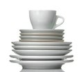 A stack of dishes. Dinnerware. plates and cup on a white isolated background. close-up Royalty Free Stock Photo