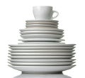 A stack of dishes. Dinnerware. plates and cup on a white isolated background. close-up Royalty Free Stock Photo