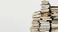 A stack of disorganized books piled high on a white background Royalty Free Stock Photo