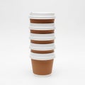 Stack of disposable coffee cups isolated on white background Royalty Free Stock Photo