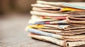 A stack of diverse vintage newspapers overlapping each displaying different headlines and imagery evoking a sense of history Royalty Free Stock Photo
