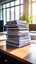 Stack of documents and books piled on a wooden desk with window light Royalty Free Stock Photo
