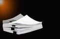 Stack documents or files on black background. Royalty Free Stock Photo