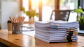 Stack of documents with office supplies on a wooden desk with sunlight Royalty Free Stock Photo