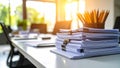 Stack of documents with pencils in a container on a white office table. Royalty Free Stock Photo