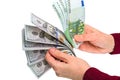 Stack of 100 dollar and euro in his hands Royalty Free Stock Photo