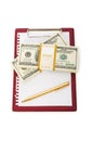 Stack of dollars and blank pad Royalty Free Stock Photo