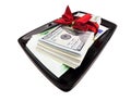 Stack of dollars & euros with gift ribbon on black plate